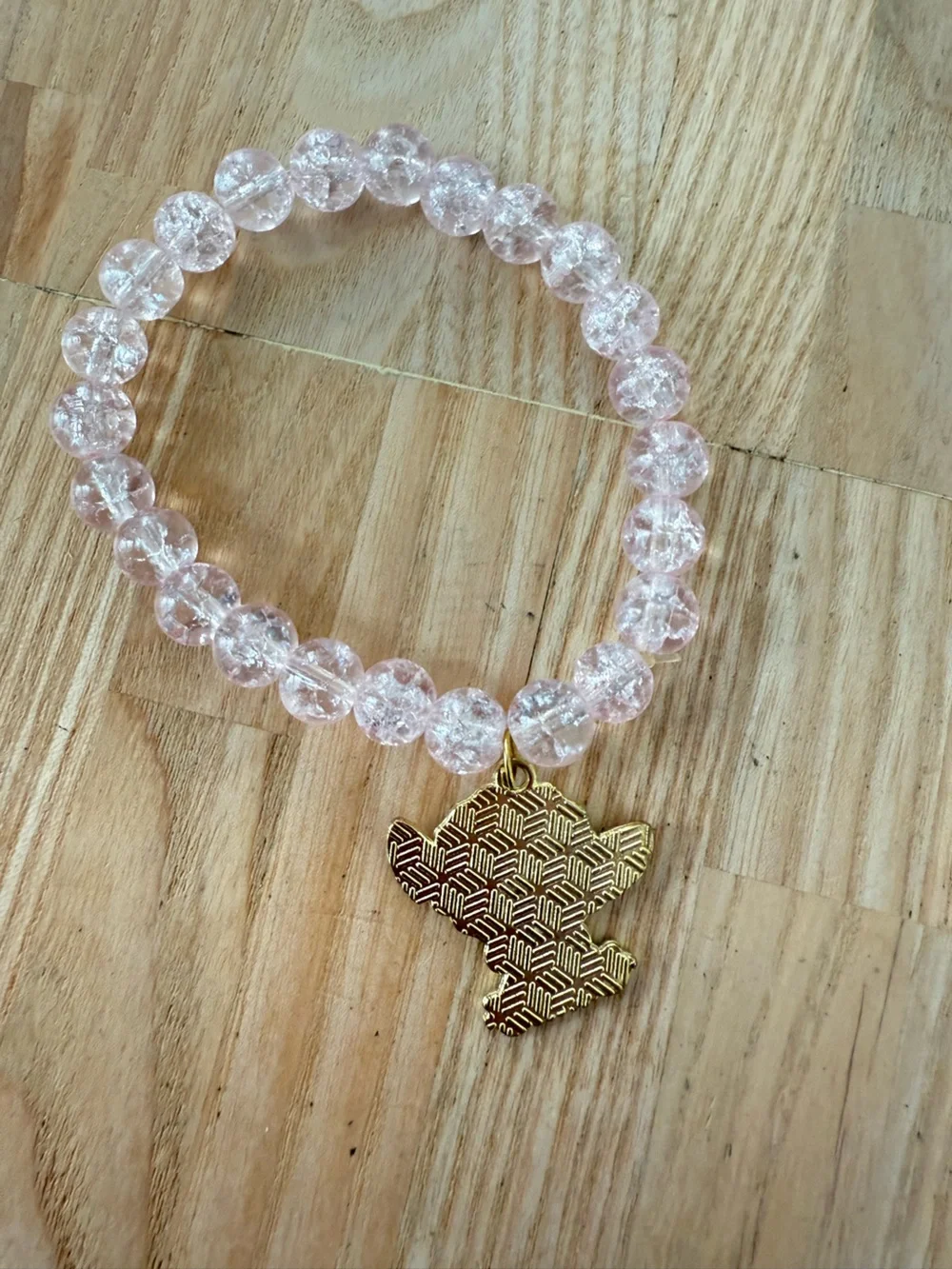 Baby Stitch from LILO & Stitch light pink crackle-glass bead stretch bracelet